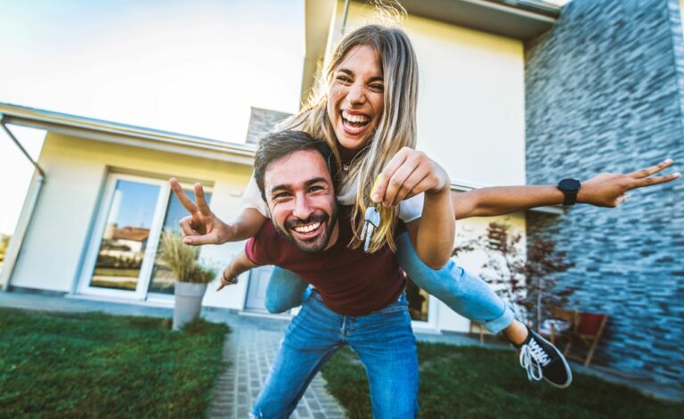 Happy,Young,Couple,Holding,Home,Keys,After,Buying,Real,Estate